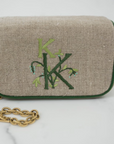 Ellis Hill Kris Case, in linen or plastic-coated cotton, with monogram, 11 in. by 9.5 in.